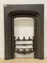 A Victorian cast iron fire insert. H95cm, W69cm.