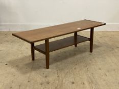 A mid century teak coffee table, the rectangular top raised on square tapered supports united by