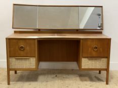 McIntosh of Kirkcaldy, A mid century teak dressing chest, fitted with triptych mirror above drawers,