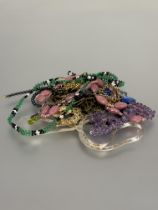 A collection of costume jewellery to include an amethyst bead necklace L x 9cm, an Italian silver