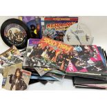 A large quantity of vintage records/vinyl tins, mainly 80's metal/rock and roll, comprising ACDC,