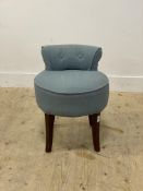 A dressing table stool, the seat and back upholstered in blue linen, raised on square tapered and