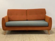 G-plan, a contemporary three seat sofa, vibrantly upholstered and raised on turned, tapered, and