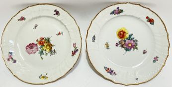 A pair of Royal Copenhagen gilt-edge plates decorated with floral sprays (marked verso, w- 22cm)