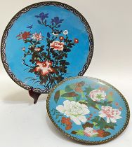 A Japanese Meiji period cloisonne enamel charger decorated with birds and flowers on a blue