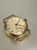 A gentleman's vintage Moeris 9ct gold wristwatch with silvered dial and arabic numerals and