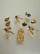 A collection of earrings and pendants to include a pair of 9ct gold star drop earrings  missing