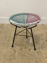 A Vintage lamp table, the circular glass top raised on three splayed supports. H46cm.