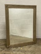 A traditional wall mirror with bevelled plate within a silvered frame. 94cm x 120cm