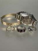 A collection of jewellery to include a gilt metal stiff hinged bangle, a lady's Rotary stainless