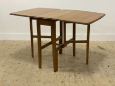 A mid century teak veneered duo drop leaf dining table, raised on square tapered supports. H75cm,