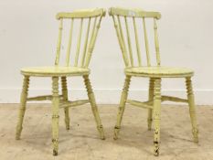 A pair of late 19th century Arts and Crafts green painted hardwood side chairs, with comb backs