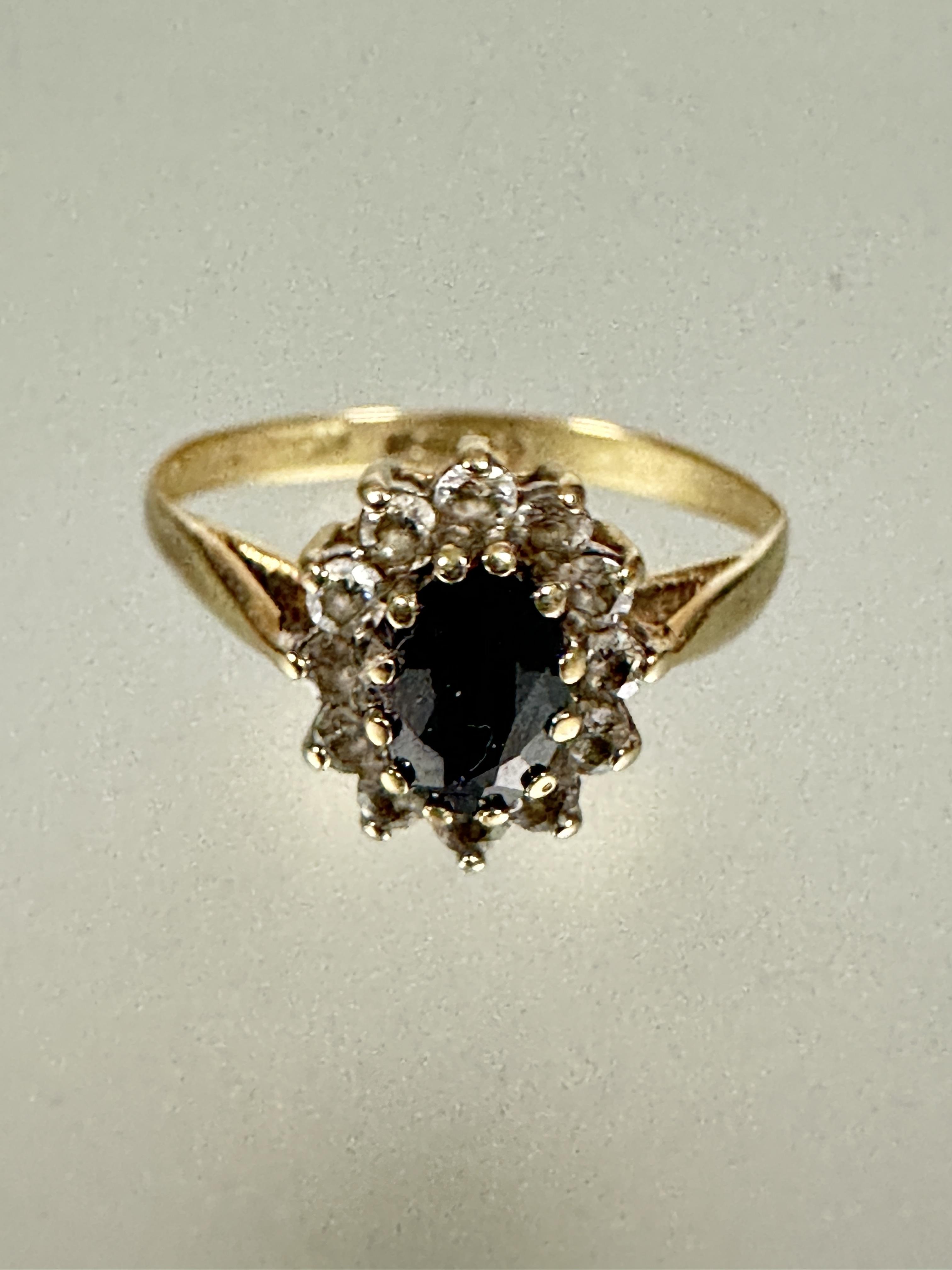 A 9ct gold sapphire and clear stone cluster ring O 1.51g