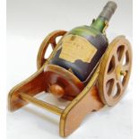 Courvoisier, a bottle of 'Napoleon' cognac brandy with cannon form bottle holder/pourer and label