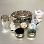 A crystal slice cut glass panel sided ointment jar with Chester silver chased top depicting two