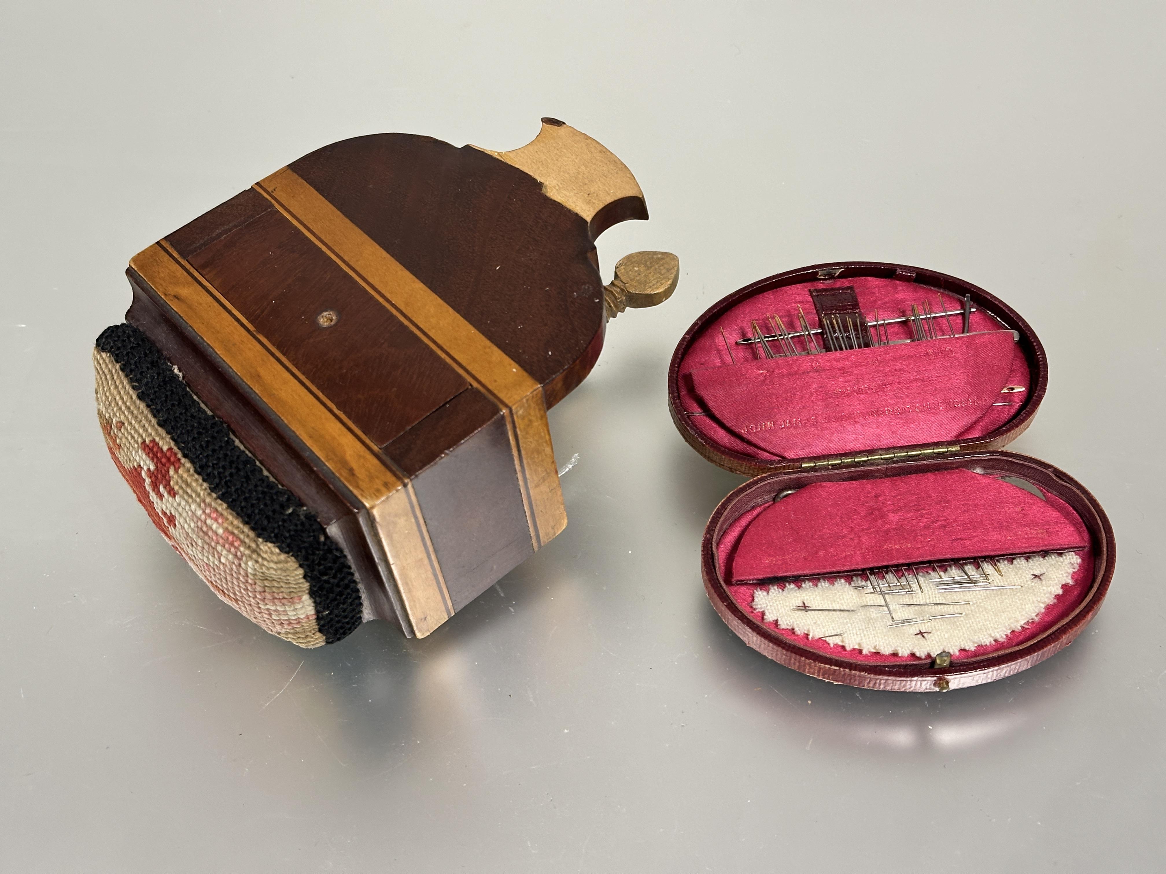 A Edwardian John James & Sons Reddich Moroccan faded red leather shaped sewing case fitted with