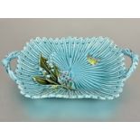 A 19thc Minton style two handled majolica dish of fluted basket style design turquoise glaze with