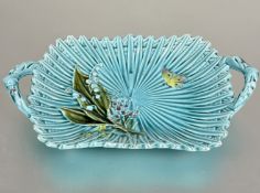 A 19thc Minton style two handled majolica dish of fluted basket style design turquoise glaze with