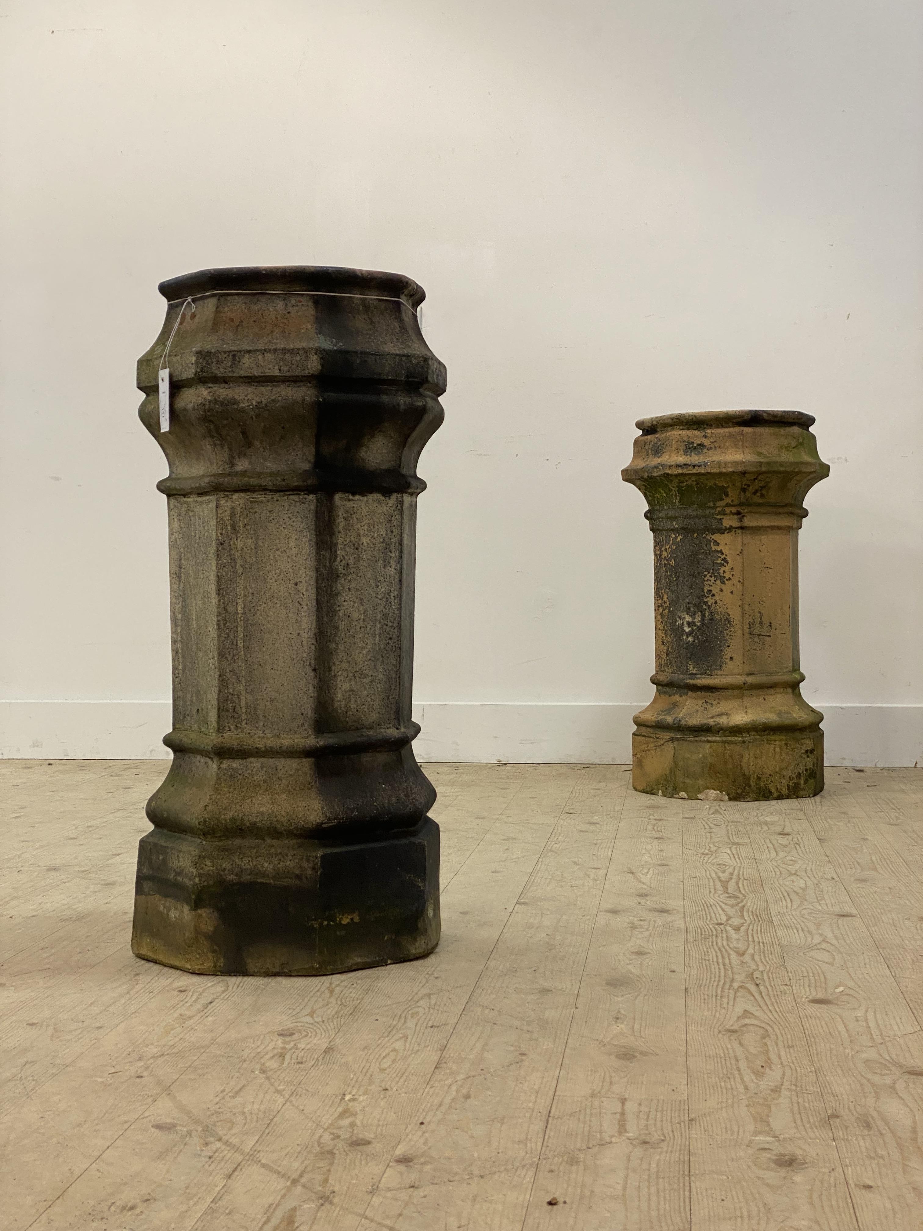 A near pair of 19th century fireclay chimney pots, 19th century, each of faceted octagonal form.