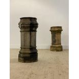 A near pair of 19th century fireclay chimney pots, 19th century, each of faceted octagonal form.
