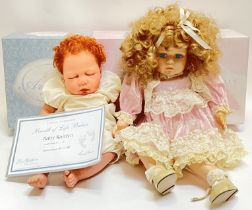 A boxed Lee Middleton 'Baby Kaitlyn' Doll complete with certificate of authenticity and Baby Bible
