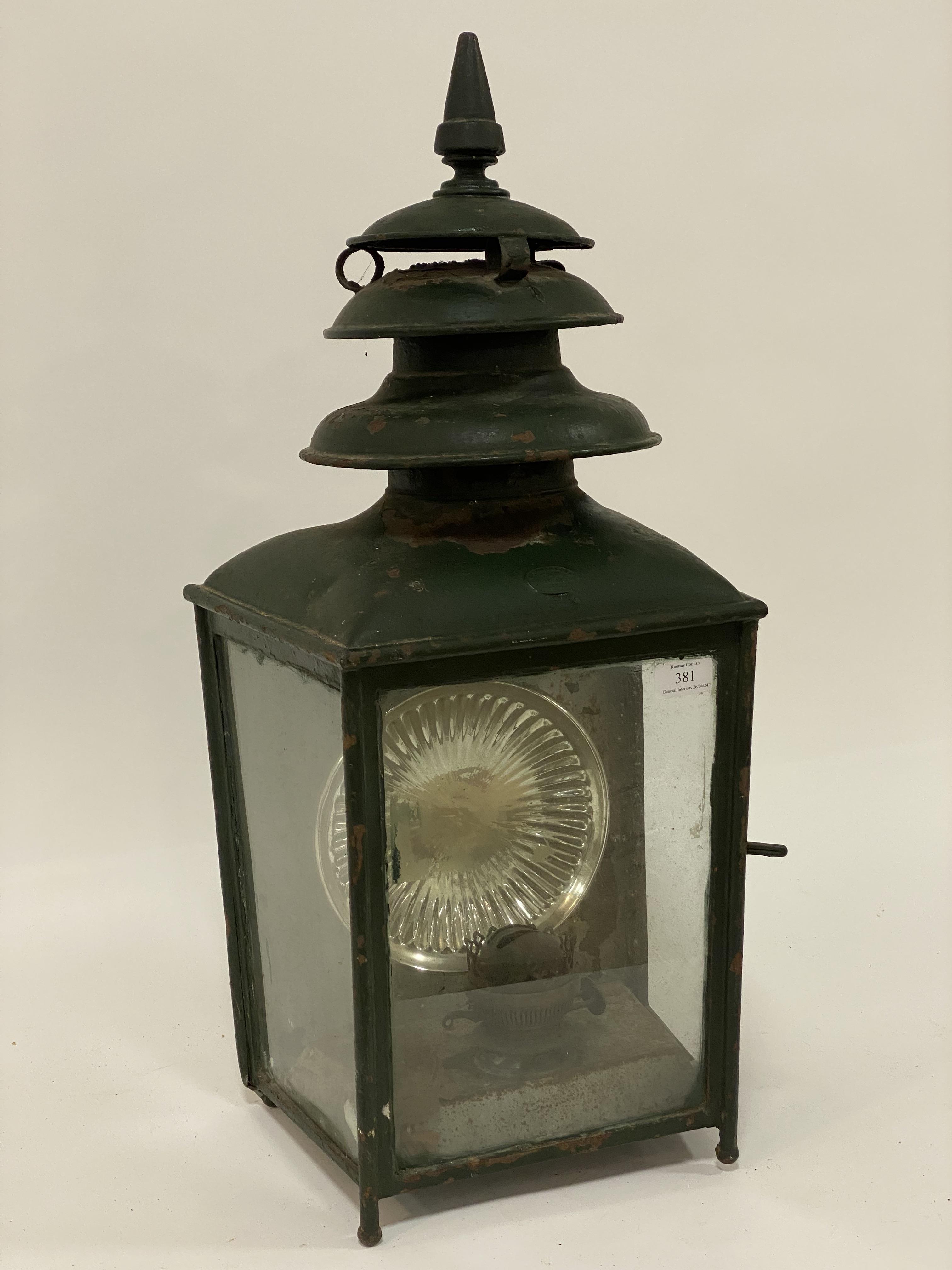 A 19th century green painted station wall lantern, bearing Pitter & Sons metal label, fiinial on