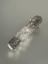A Victorian silver mounted ended smelling salts bottle with hob nail cut design missing inner