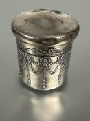 A Edwardian silver dressing room jar and cover the domed top with Adam style ribbon and floral swags