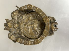 A reproduction heraldic inspired cast brass door knocker of shield shape with swan surmount above