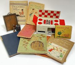 A group of vintage and antique Children's toys and books comprising a toy stove with associated