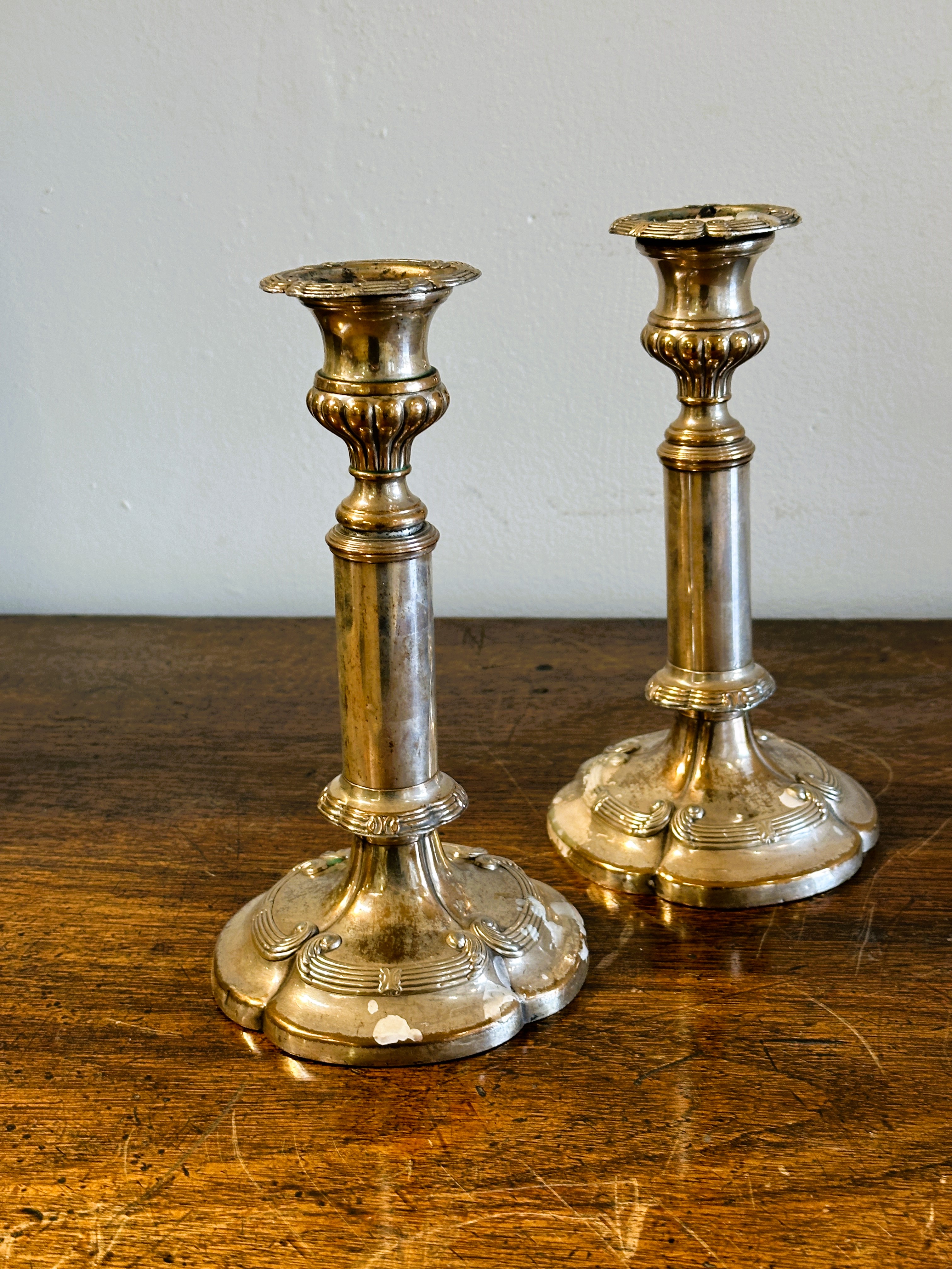 A Victorian pair of Sheffield plated telescopic candle sticks on tapered columns and scalloped - Image 3 of 3