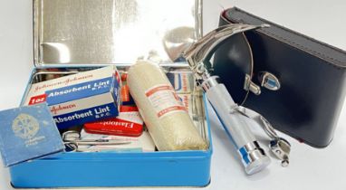 A vintage Johnson & Johnson 'Domestos' first aid kit with scissors, elastoplast, bandages etc...