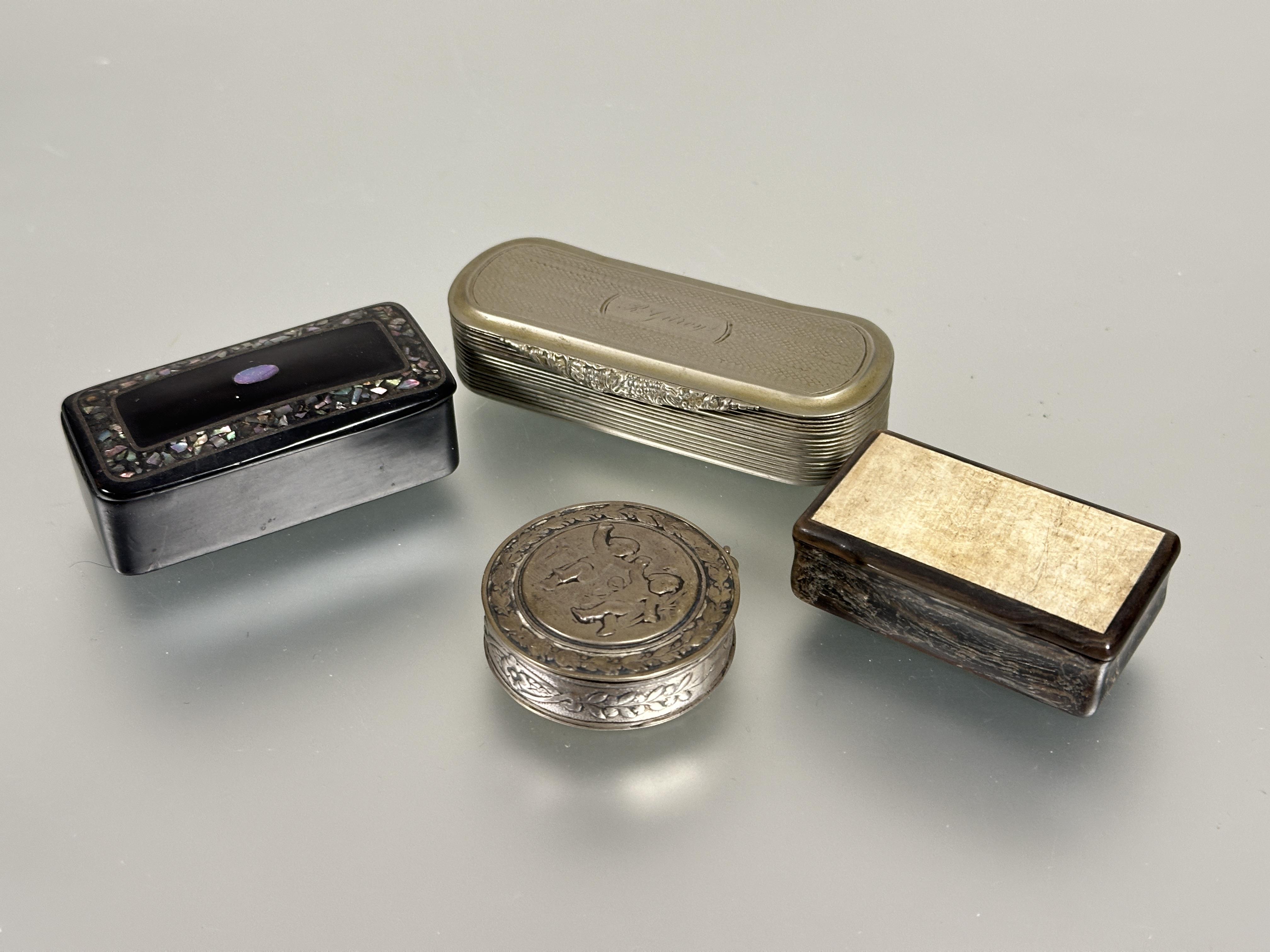 A collection of three snuff boxes to include and white metal rectangular box with engine turned
