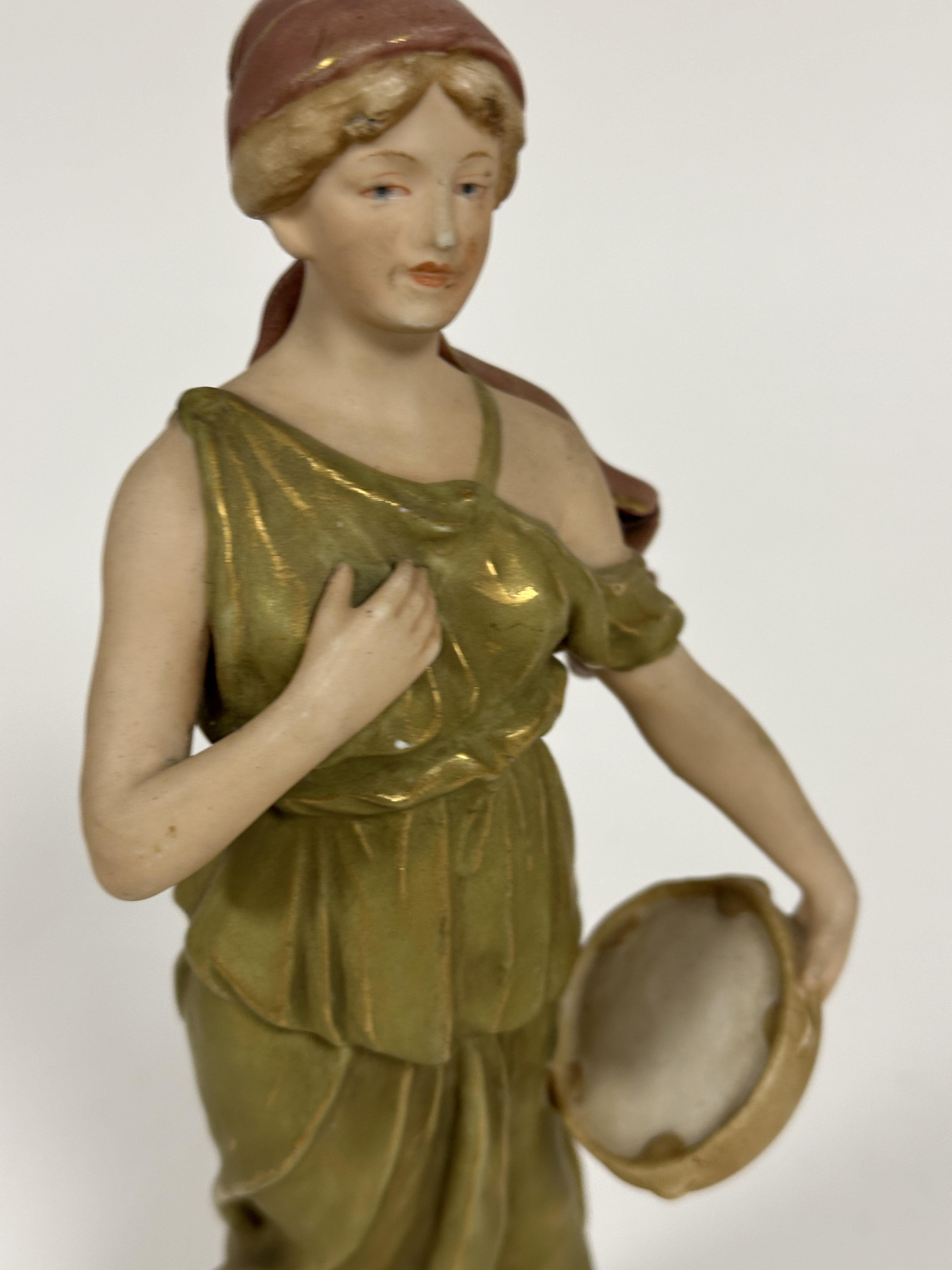 A Austrian Royal Dux figure of a maiden with tambourine in green tunic standing on circular - Image 4 of 5