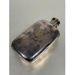 A Edwardian Epns hip flask of rounded rectangular form with screw down locking hinged cap engraved