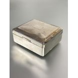 A Birmingham silver cigarette box the top with engine turned decoration enclosing a cedar lined