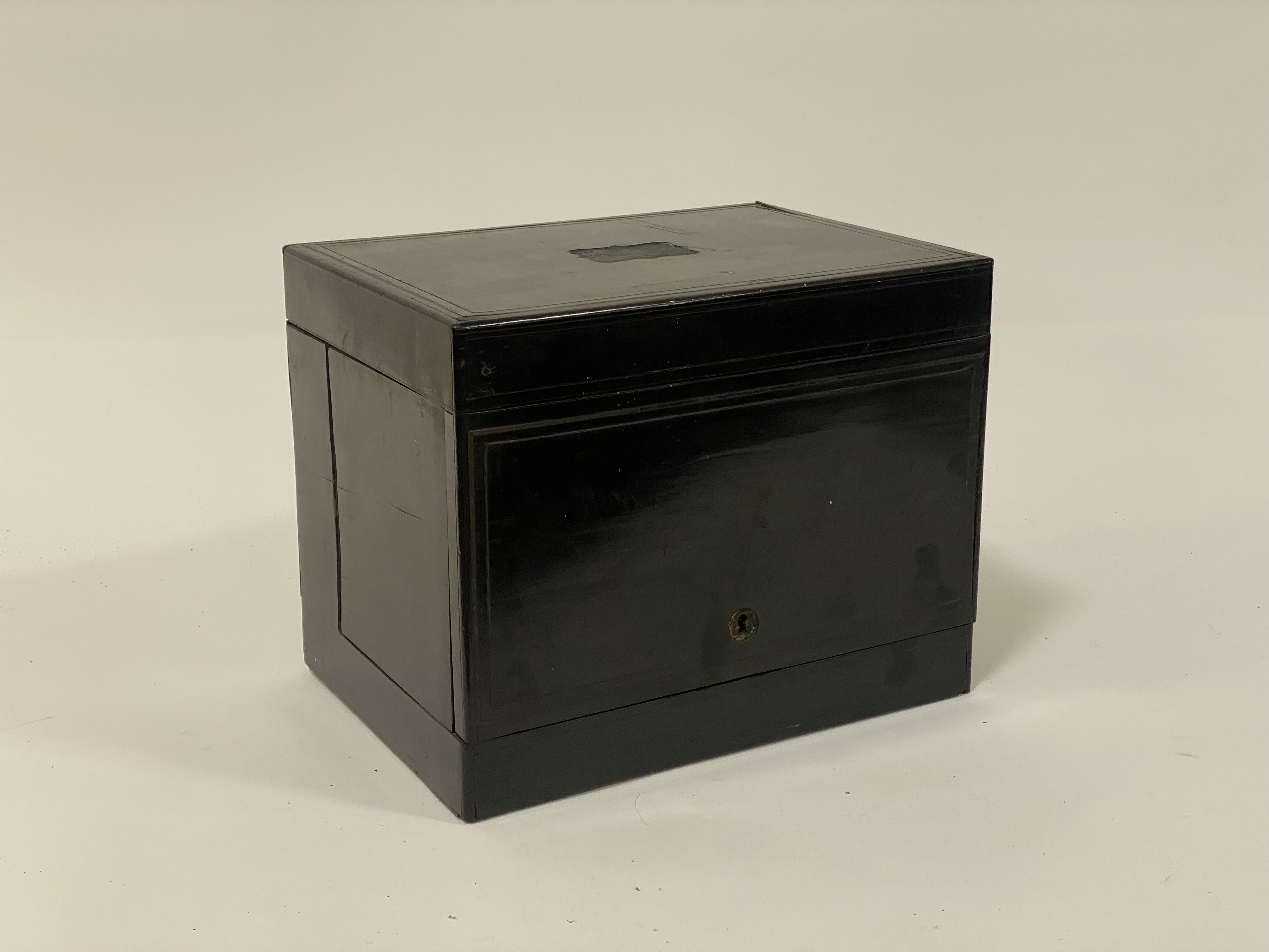 A mid19th century ebonised tantalus or drinks casket, the hinged lid enclosing a simulated - Image 2 of 3