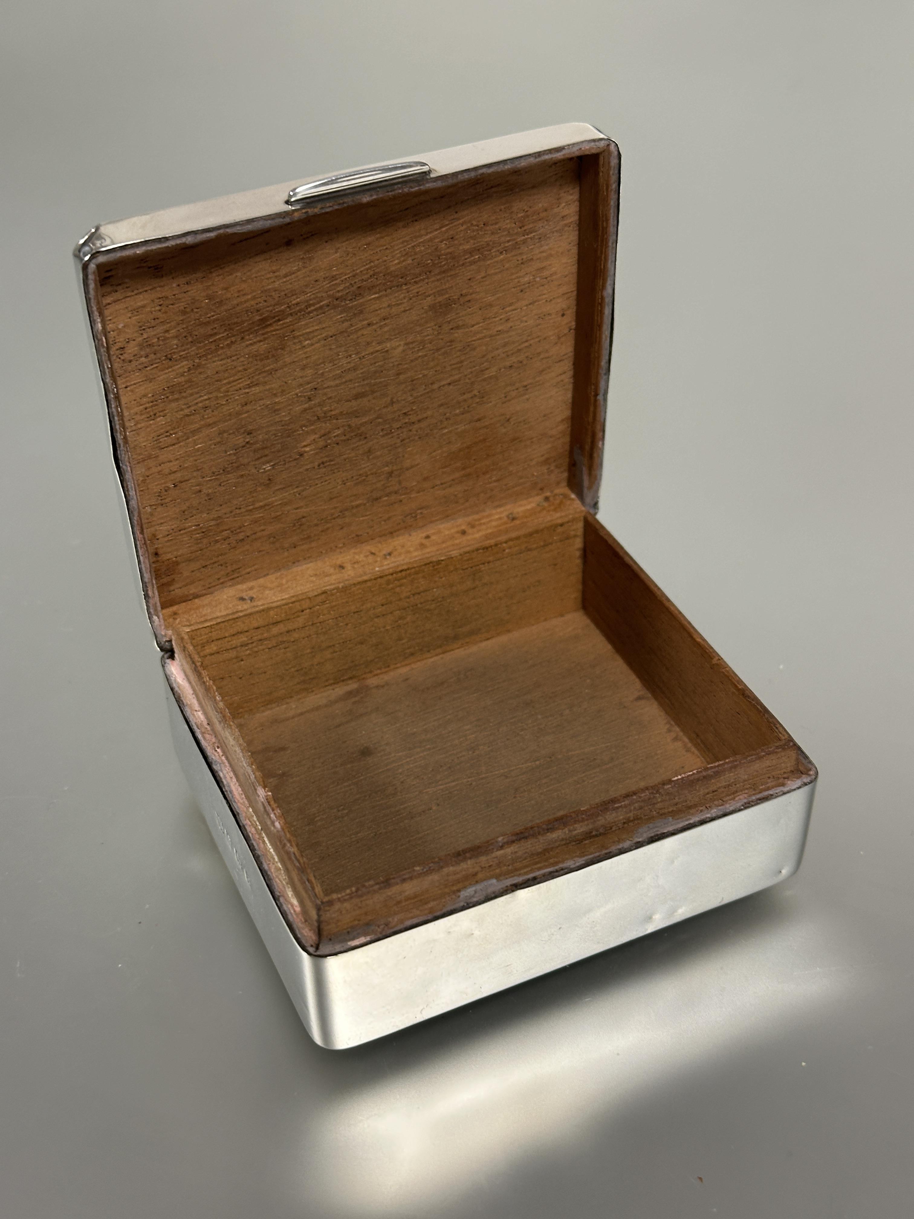 A Birmingham silver cigarette box the top with engine turned decoration enclosing a cedar lined - Image 3 of 3