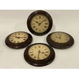 A set of four General Post Office electric wall clocks , the white dials with Roman chapter ring and