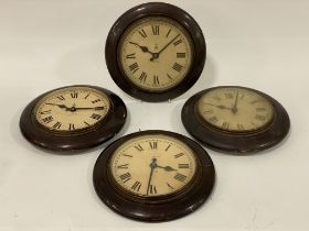 A set of four General Post Office electric wall clocks , the white dials with Roman chapter ring and