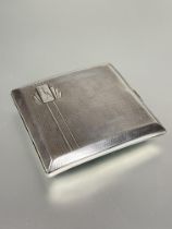 A Birmingham silver cigarette case of square curved pocket design with Art Deco engraved and