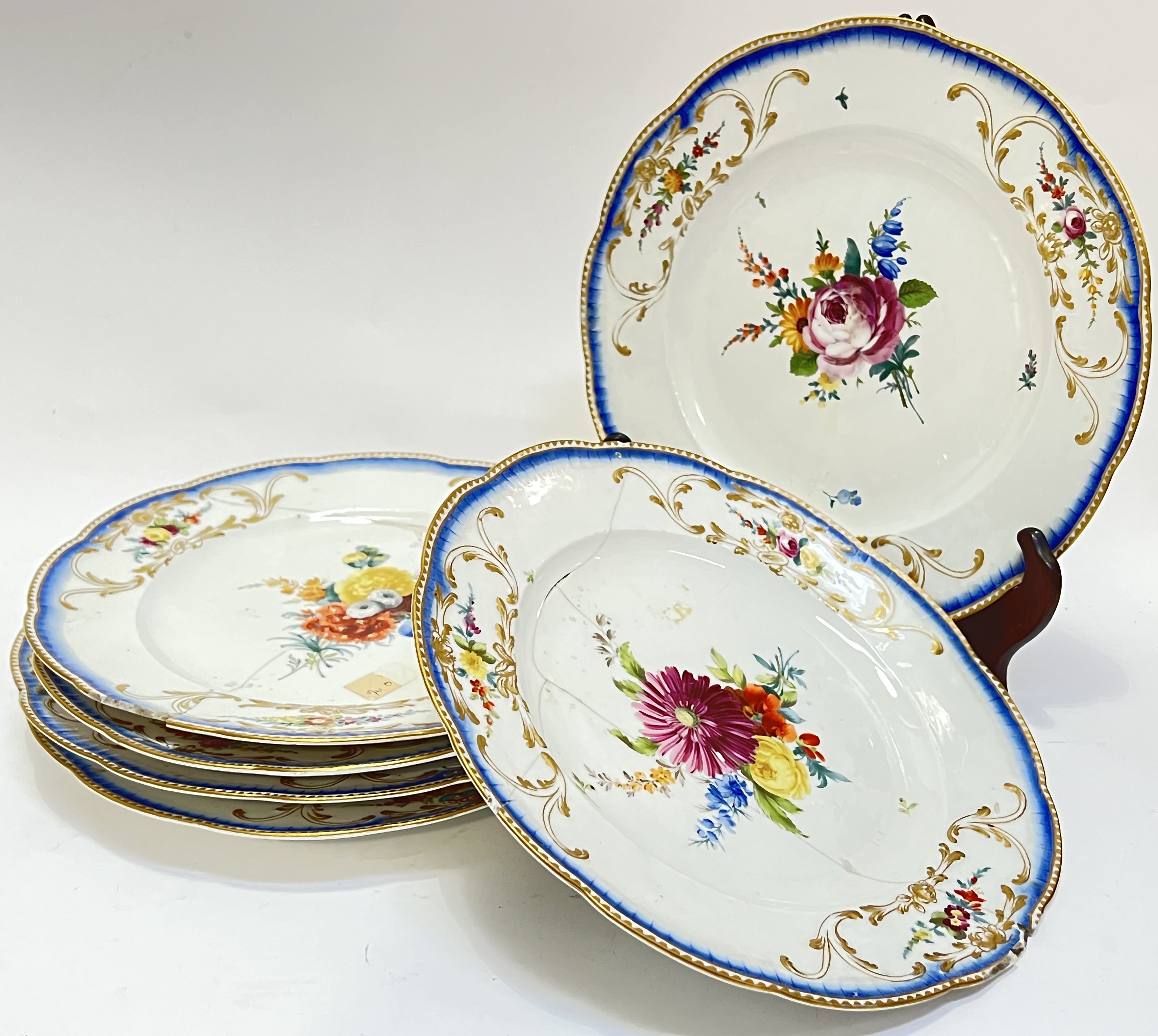 Six nineteenth century gilt-edge Meissen porcelain dishes each with moulded border and polychrome