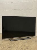 A 39" Panasonic LCD television with power lead and remote.