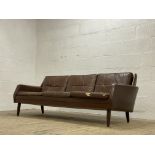 A Danish mid century three seat sofa, circa 1960's / 70's, the frame and squab cushions