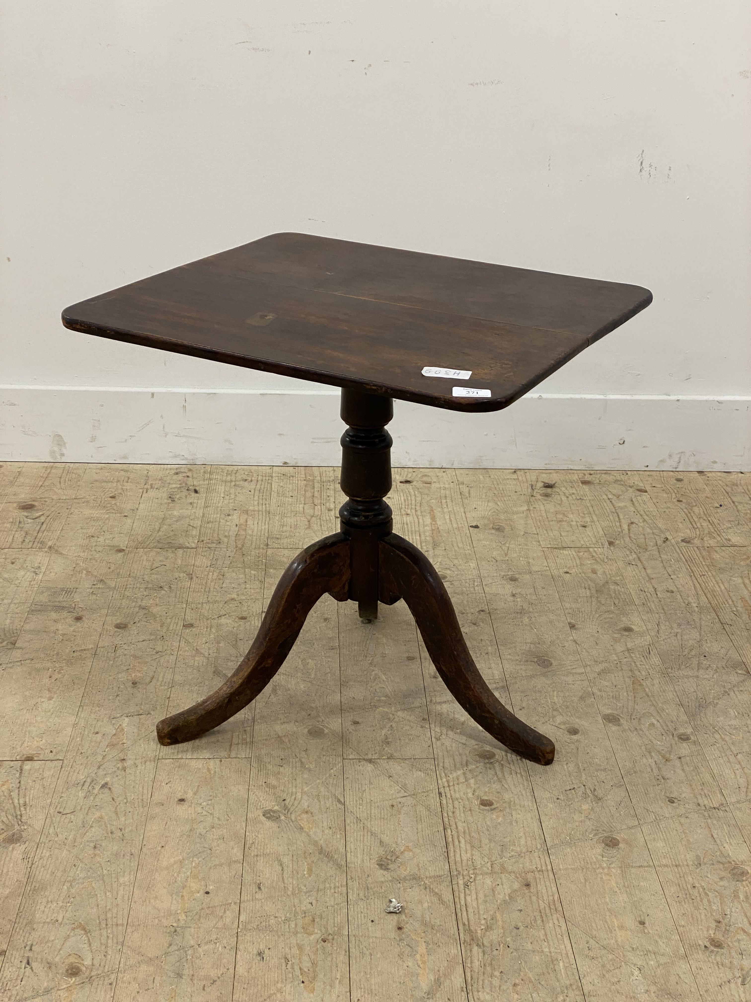 An early 19th century mahogany tilt top occasional table, the rectangular top on three splayed