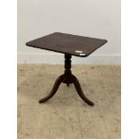 An early 19th century mahogany tilt top occasional table, the rectangular top on three splayed