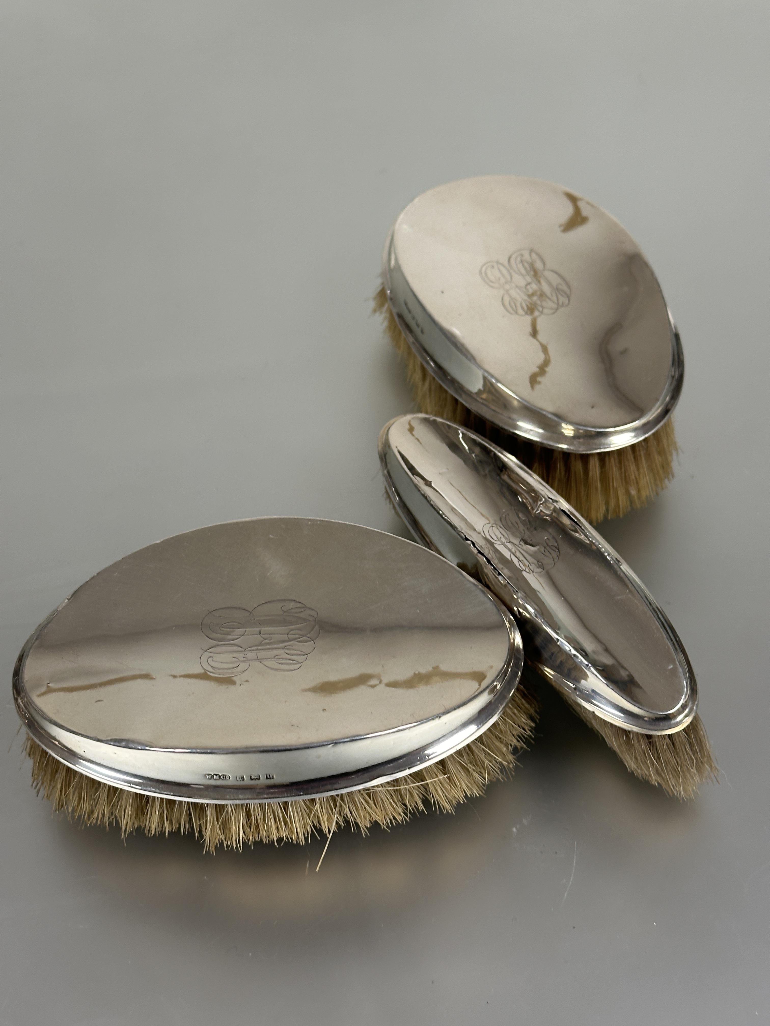 A set of three Edwardian Birmingham silver backed Gents hair and clothes brush with engraved with - Image 2 of 2