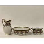 A Victorian Losol Ware three piece ceramic wash set, comprising a ewer, basin, and commode (a/f)