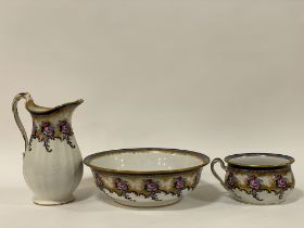 A Victorian Losol Ware three piece ceramic wash set, comprising a ewer, basin, and commode (a/f)