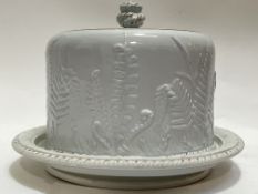 A Victorian gilt pottery cheese dome with low-relief decoration of ferns (impressed marks verso,